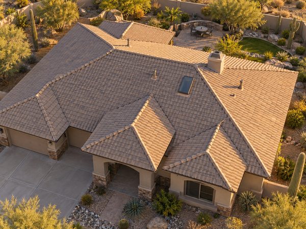 Elevated view across a tile roof with ridge, valleys, and roof penetrations visible